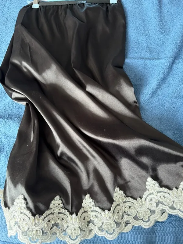 Handmade lingerie skirt in breathable espresso satin with scalloped cream lace trim.